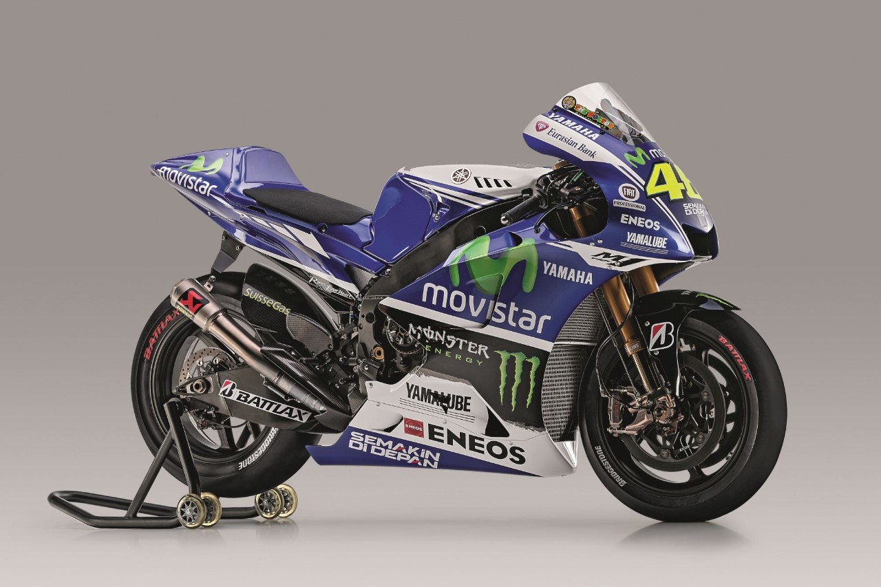 <div class='descrGalleryTitle'>2014 - Yamaha YZR-M1 - MÀRQUEZ NON PERDONA</div><div class='descrGalleryText'><p>La stagione comincia positivamente, grazie alla conquista del secondo posto in Qatar. Rossi c’è e la Yamaha YZR-M1 si conferma una delle moto più competitive. Il binomio Honda Màrquez, tuttavia, risulta imbattibile e il campionato si chiude con un secondo posto, dietro al fortissimo pilota catalano.</p>
</div>